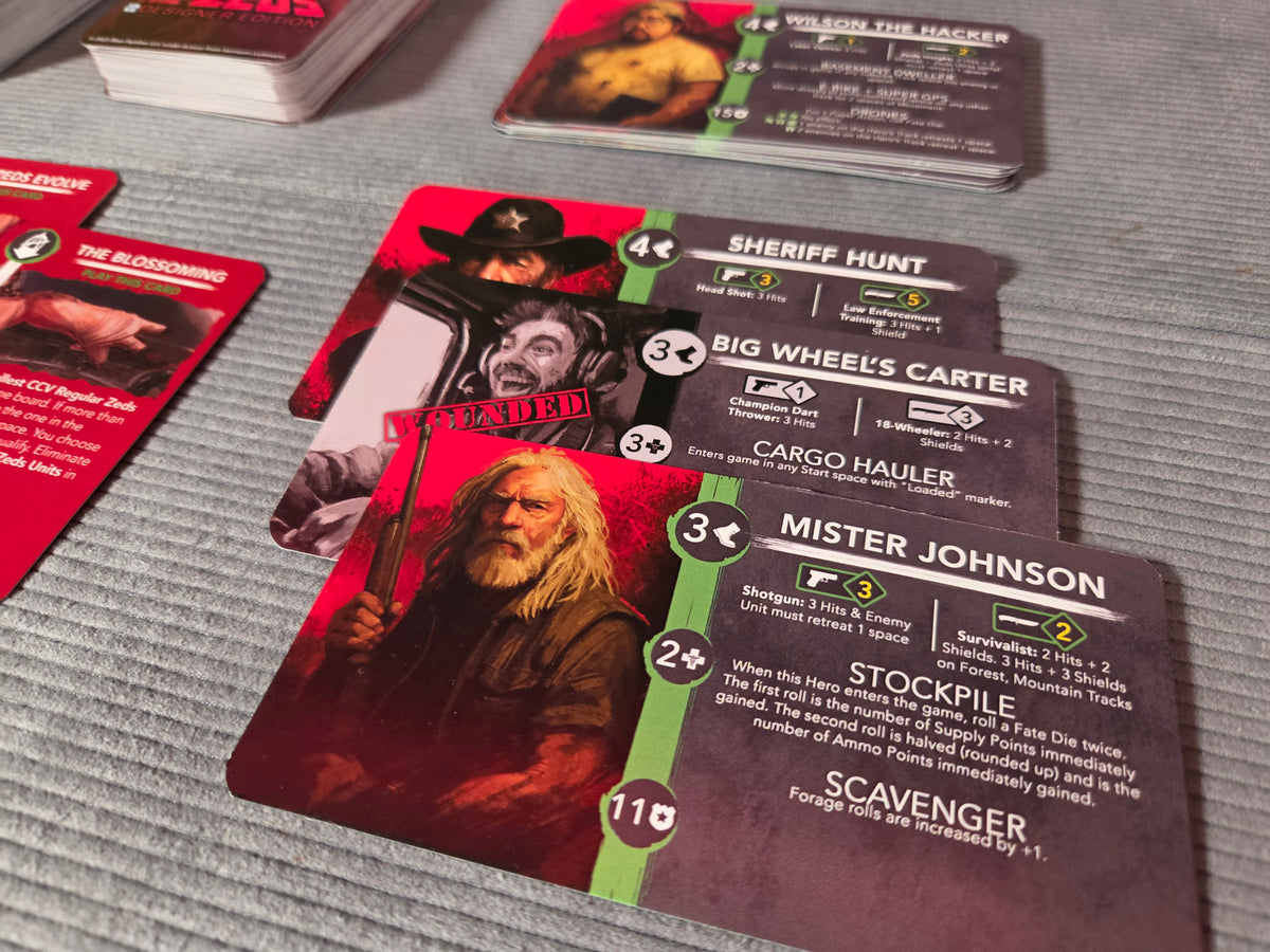 Collection of cards featuring characters and text on a gray surface