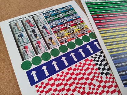 Collection of colorful counter sheets with various designs on a textured surface