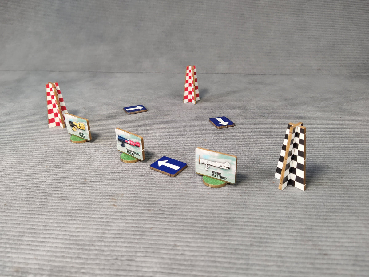 Set of miniature race track obstacles on a gray surface